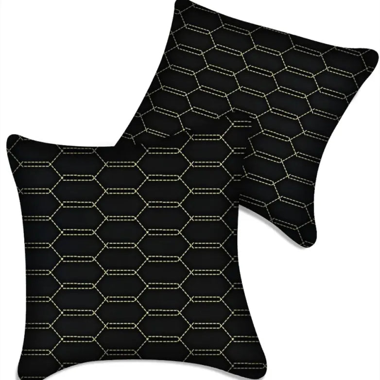Black leather vehicle pillows with gold stitching